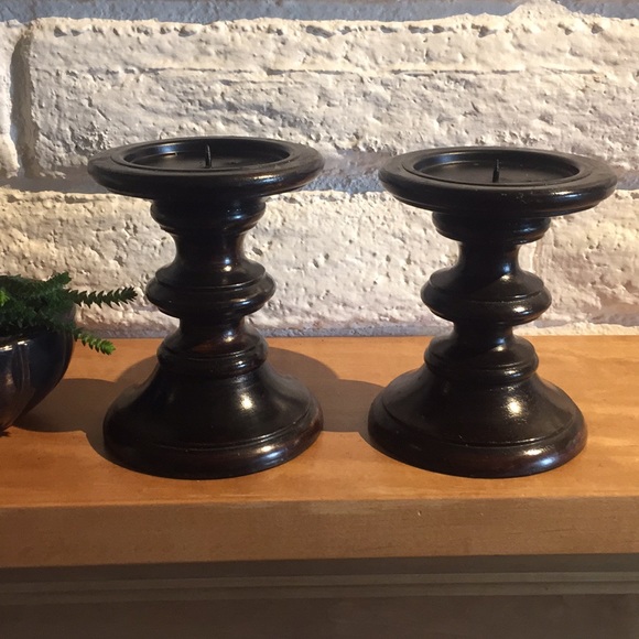 Two brown wood candle holders.